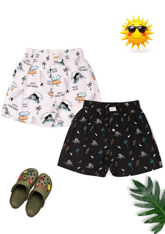 CLLING Boys 2-Pack Pure Cotton Printed Boxer Shorts - White Surfing & Black Palm Tree Print